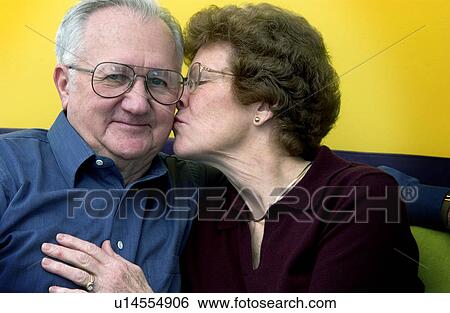 Stock Photograph - Senior couple on couch. Fotosearch