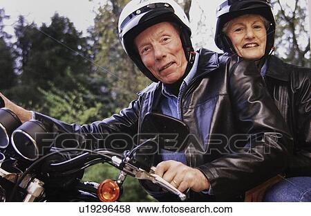 Stock Photo - Senior couple on motorcycle. Fotosearch