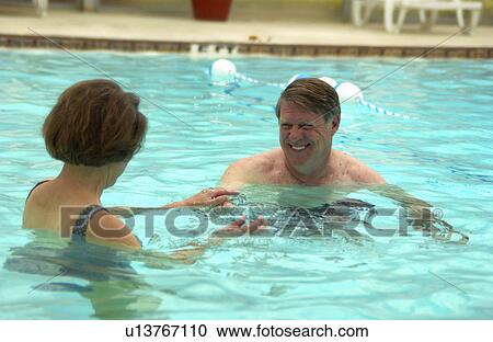 Senior couple swimming View Large Photo Image Stock Image - Senior couple swimming. Fotosearch