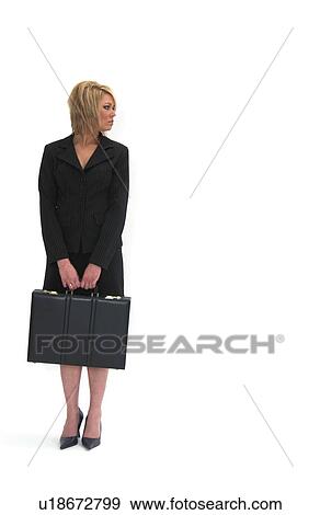 Stock Photo - Businesswoman holding briefcase. Fotosearch