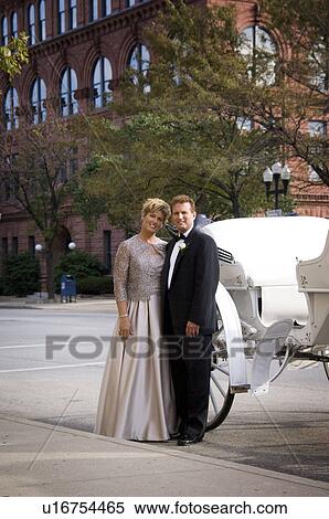 Couple in front of horse and carriage View Large Photo Image Stock Photography - Couple in front of horse and carriage. Fotosearch