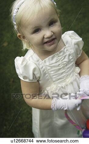 Picture - Girl in dressy attire. Fotosearch