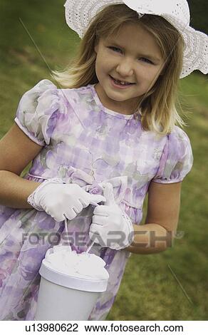 Girl in Easter outfit View Large Photo Image Stock Image - Girl in Easter outfit. Fotosearch