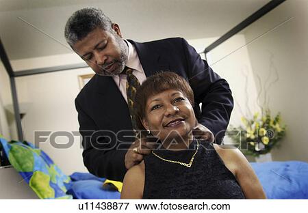 Senior couple getting ready for a night out View Large Photo Image Stock Photo - Senior couple getting ready for a night out. Fotosearch