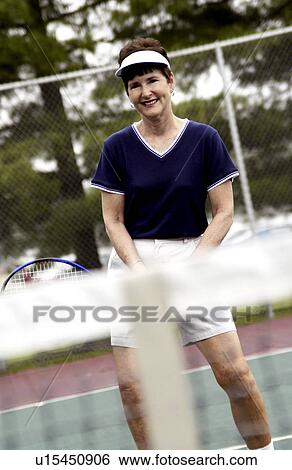 Senior woman playing tennis View Large Photo Image Stock Photograph - Senior woman playing tennis. Fotosearch