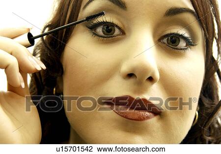 Woman applying makeup View Large Photo Image Stock Image - Woman applying makeup. Fotosearch