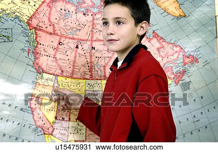 Stock Image - Boy at map. Fotosearch