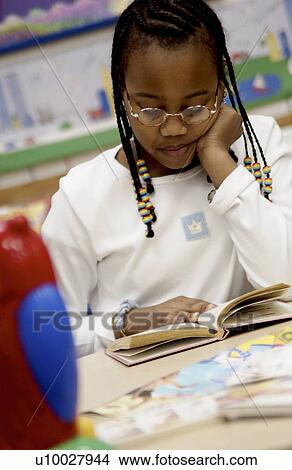 Child reading in class View Large Photo Image Picture - Child reading in class. Fotosearch
