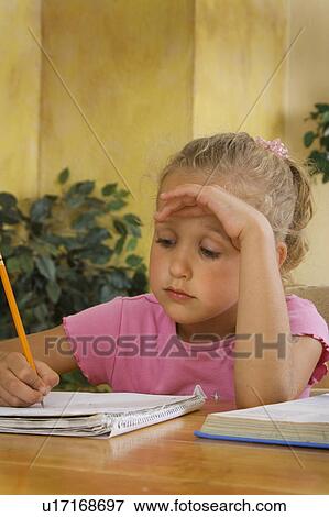 Stock Photo - Girl doing homework. Fotosearch