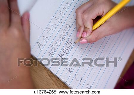 Stock Photography - Girl doing homework. Fotosearch