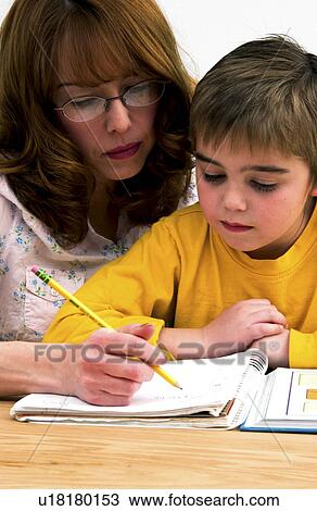 Mother helping son with homework View Large Photo Image Stock Image - Mother helping son with homework. Fotosearch