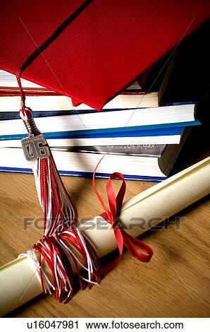 School books graduation cap tassel and diploma View Large Photo Image Stock Image - School books graduation cap tassel and diploma. Fotosearch