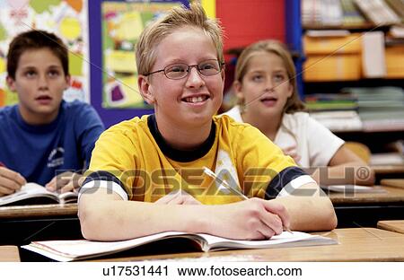 Stock Image - Students in classroom. Fotosearch