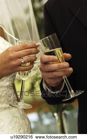 Bride and groom toasting View Large Photo Image Stock Photograph - Bride and groom toasting. Fotosearch