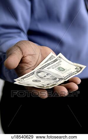Businessman holding money View Large Photo Image Stock Photo - Businessman holding money. Fotosearch