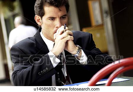 Stock Image - Businessman working outside. Fotosearch
