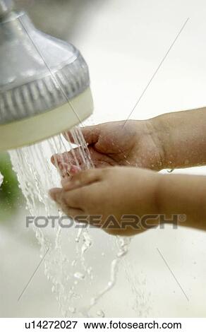 Child washing their hands View Large Photo Image Stock Photo - Child washing their hands. Fotosearch
