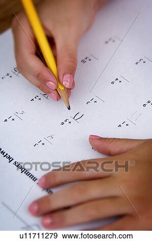 Stock Photo - Girl doing homework. Fotosearch