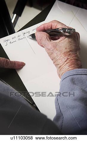 Stock Photo - Senior woman writing a letter. Fotosearch
