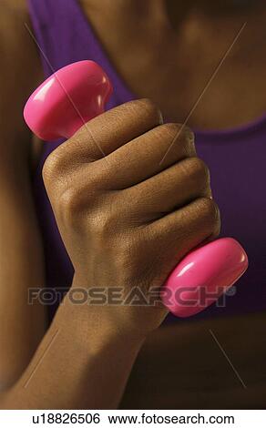 Woman lifting weights View Large Photo Image Stock Photograph - Woman lifting weights. Fotosearch