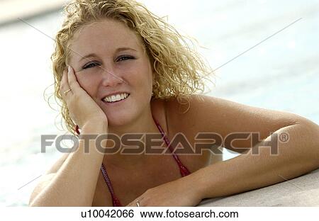 Woman standing in a pool View Large Photo Image Stock Photograph - Woman standing in a pool. Fotosearch