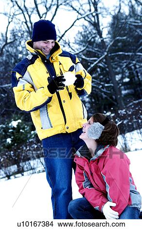 Couple in snow View Large Photo Image Picture - Couple in snow. Fotosearch