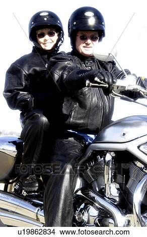 Picture - Couple on motorcycle. Fotosearch