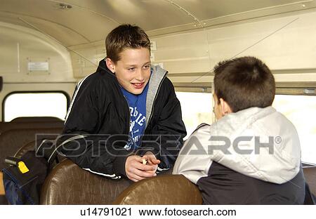 Stock Image - Kids on school bus. Fotosearch