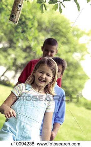 Stock Photo - Kids playing follow the leader. Fotosearch