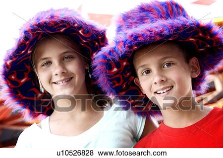 Kids wearing funky carnival hats View Large Photo Image Stock Photo - Kids wearing funky carnival hats. Fotosearch