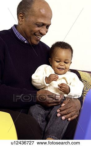 Grandpa holding grandson View Large Photo Image Stock Photo - Grandpa holding grandson. Fotosearch
