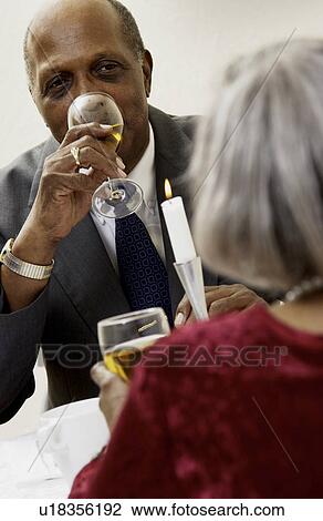 Senior couple having a romantic dinner View Large Photo Image Stock Image - Senior couple having a romantic dinner. Fotosearch