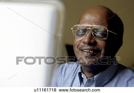 Senior man at computer View Large Photo Image Stock Photo - Senior man at computer. Fotosearch
