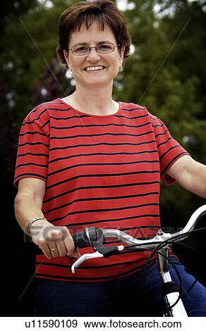 Senior woman on bicycle View Large Photo Image Stock Photo - Senior woman on bicycle. Fotosearch