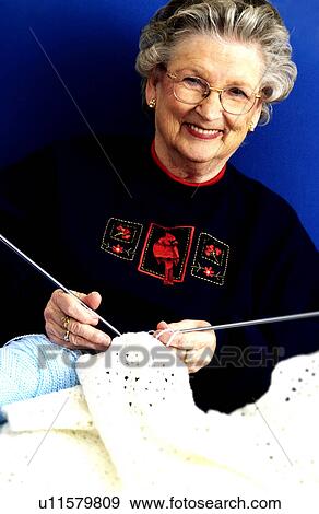 Woman knitting View Large Photo Image Stock Photo - Woman knitting. Fotosearch