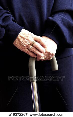 Womans hands on cane View Large Photo Image Stock Photo - Womans hands on cane. Fotosearch