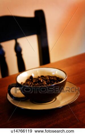 Cup of coffee beans on table View Large Photo Image Stock Photo - Cup of coffee beans on table. Fotosearch