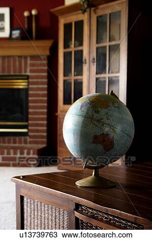 Stock Image - Hutch with globe. Fotosearch