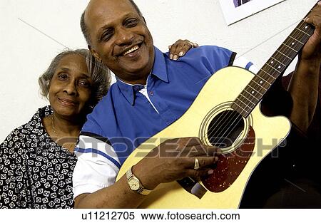 African American couple with man playing guitar View Large Photo Image Stock Photography - African American couple with man playing guitar. Fotosearch