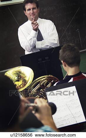 Stock Photograph - Band teacher in class. Fotosearch