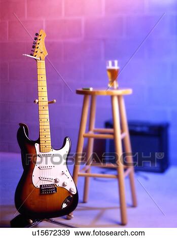 Electric guitar placed in bar scene View Large Photo Image Stock Photo - Electric guitar placed in bar scene. Fotosearch