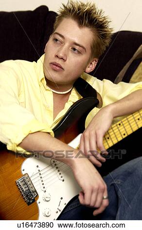 Stock Image - Guy with guitar. Fotosearch