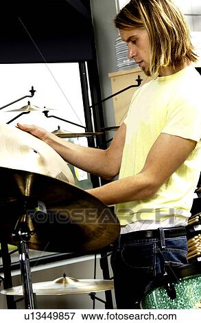 Man at guitar store View Large Photo Image Stock Photo - Man at guitar store. Fotosearch