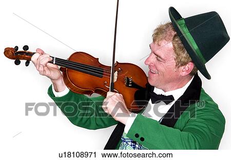 Stock Image - Man dressed as Leprechaun with fiddle. Fotosearch
