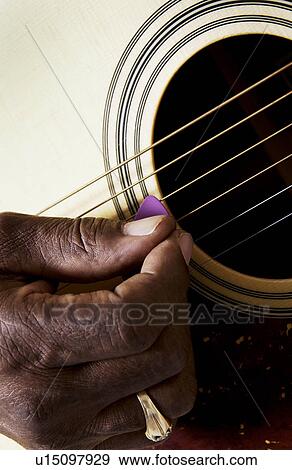 Man playing guitar View Large Photo Image Stock Photo - Man playing guitar. Fotosearch
