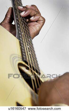 Man playing guitar View Large Photo Image Stock Photo - Man playing guitar. Fotosearch
