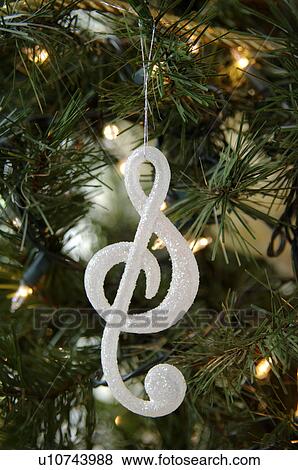 Stock Photo - Ornament hanging on Christmas tree. Fotosearch