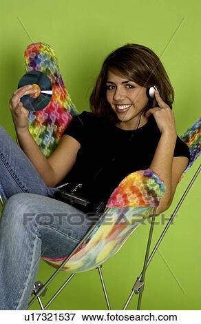 Stock Photo - Teen listening to music. Fotosearch