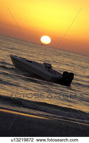 Stock Image - Boat on the ocean. Fotosearch