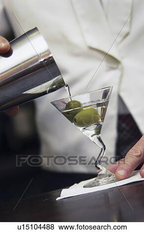Bartender making martini View Large Photo Image Stock Photo - Bartender making martini. Fotosearch